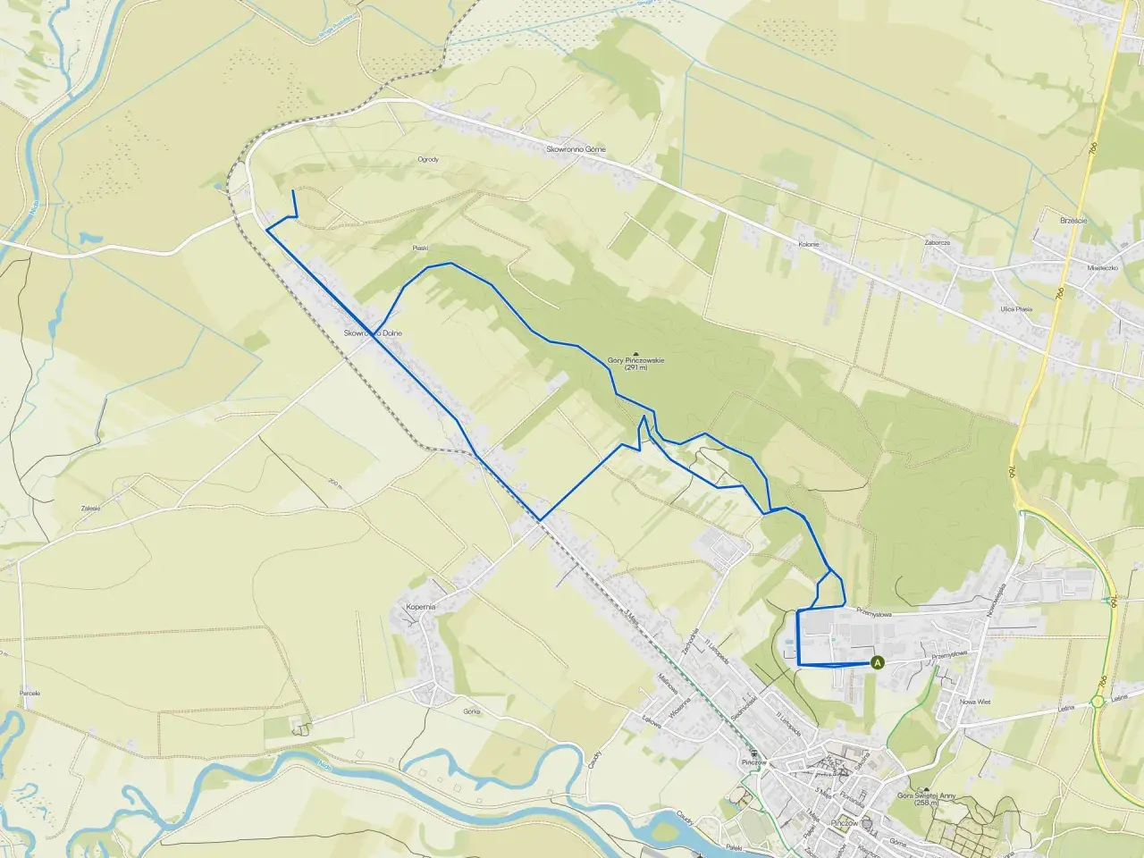 Mapa turystyczna z zaznaczonymi szlakami pieszymi w Górach Świętokrzyskich. Trasa prowadzi przez malownicze tereny, w tym okolice Góry Pińczowskiej.